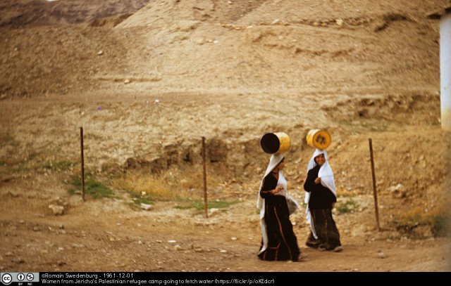 Women from Jericho's Palestinian refugee camp going to fetch water by Romain Swedenburg
