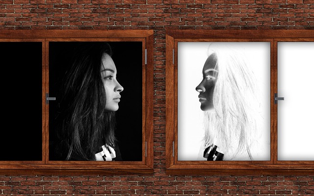 Two women stare at each other from seperate windows