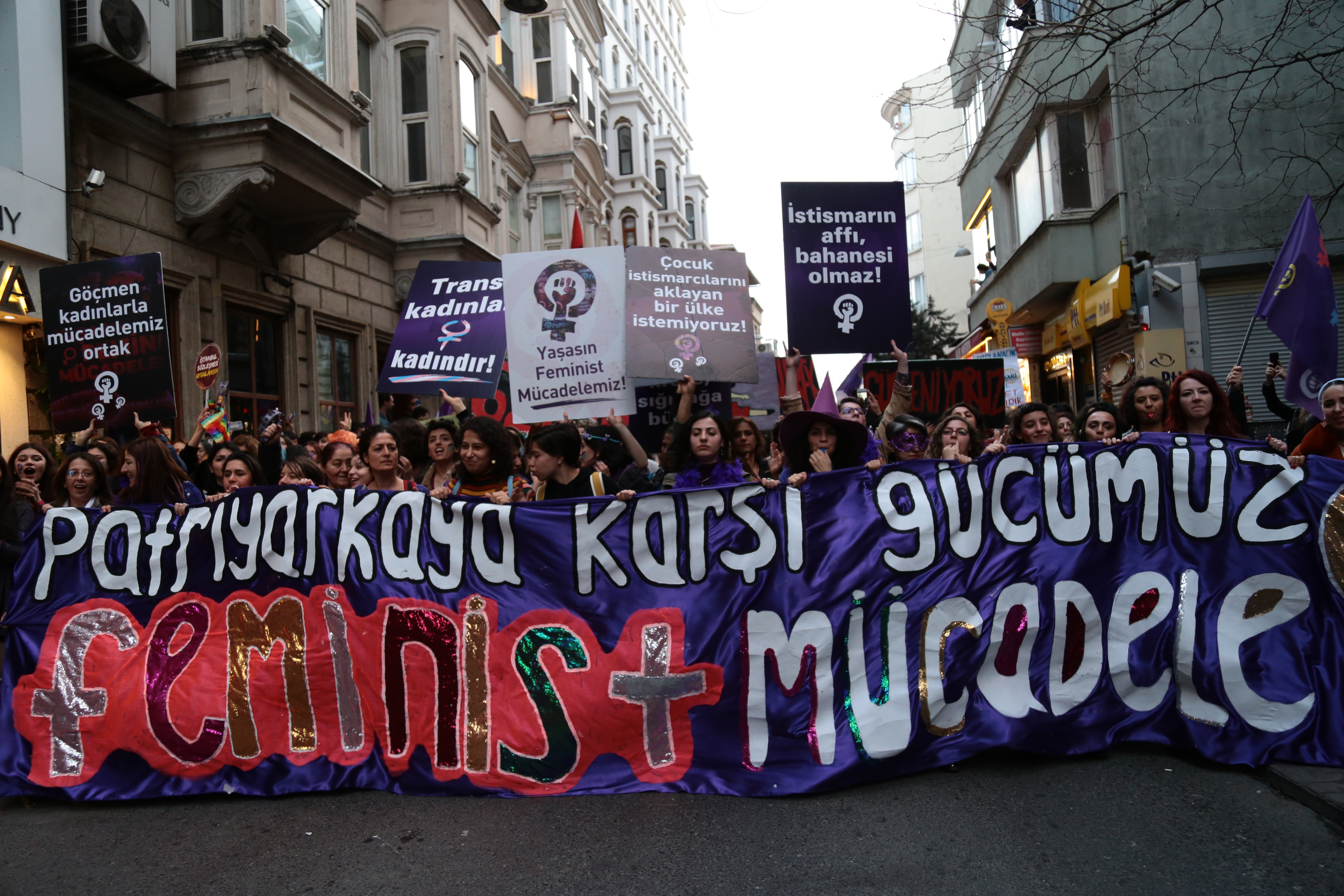 Protestors carrying banners and signs. 18th Istanbul Feminist Night March, 8 March 2020.