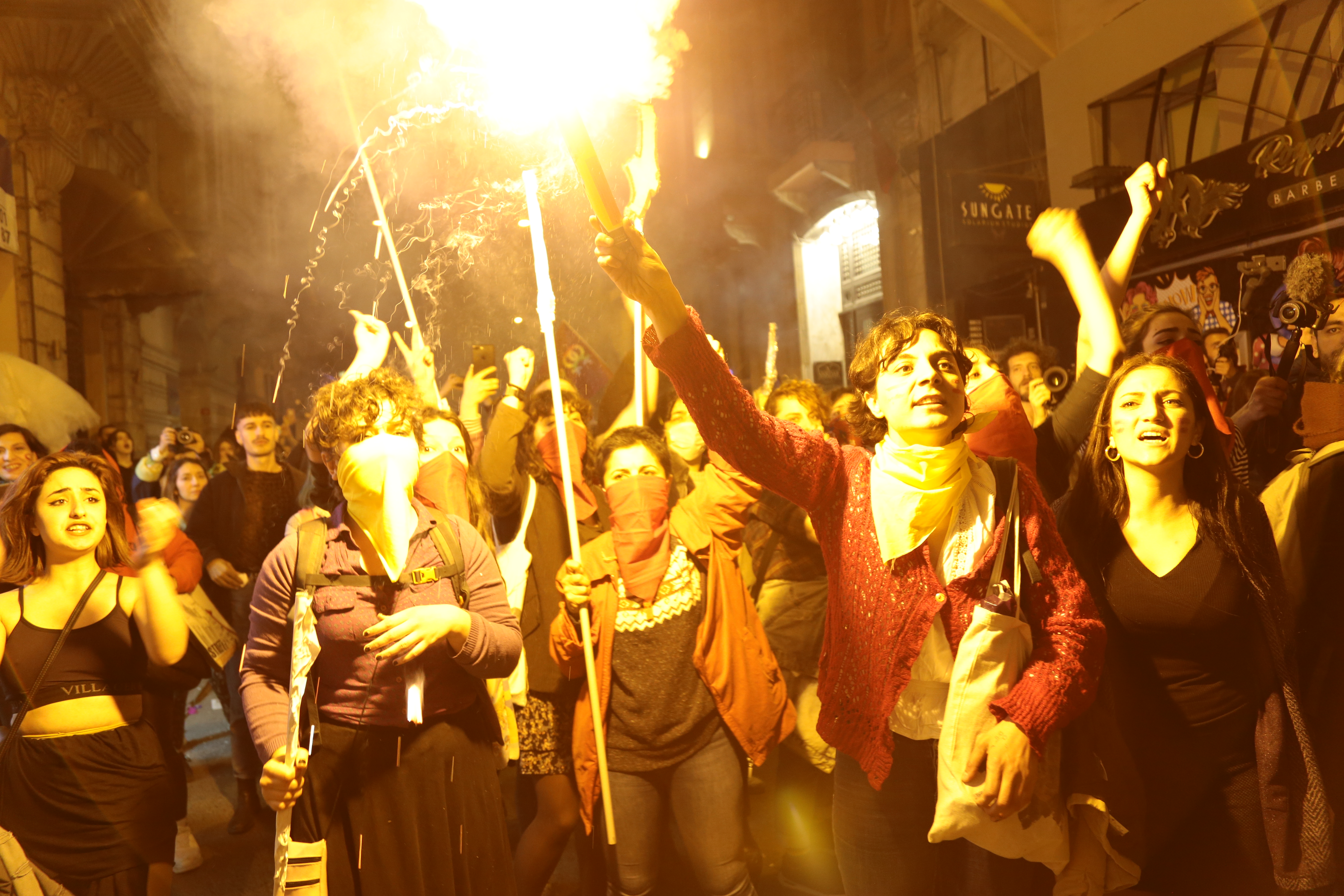 Protestors carrying flares at the 18th Istanbul Feminist Night March, 8 March 2020.