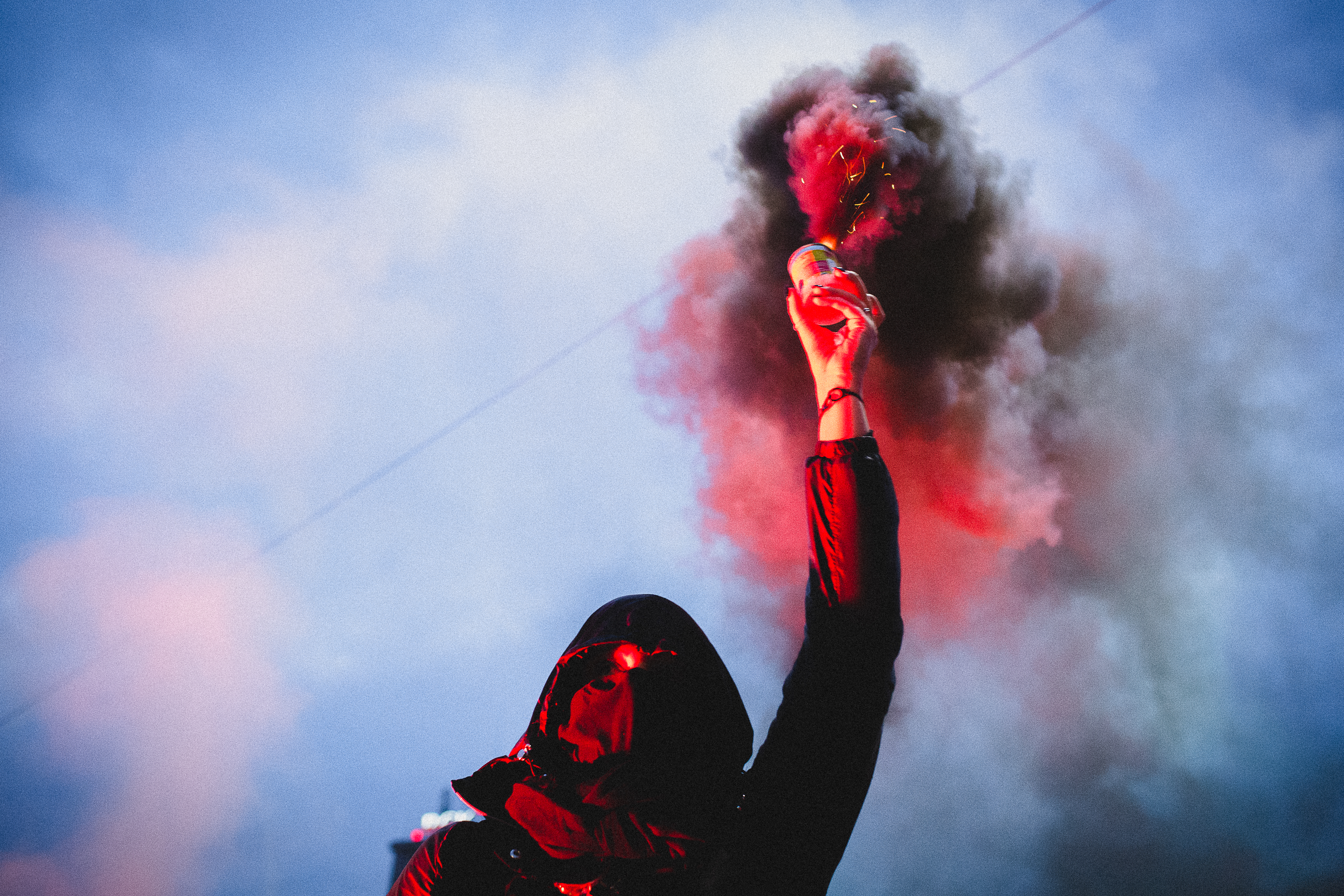 A protestor holding a flare at the Women’s Strike protests, Warsaw, Poland. October 2020.